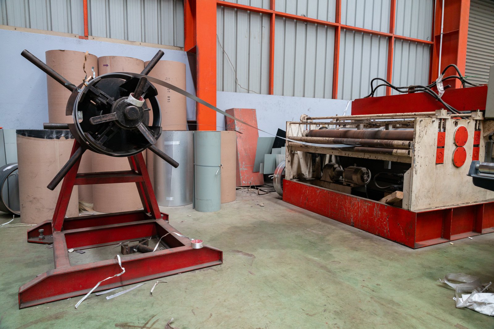 Modern stainless steel slitting and cutting equipment under sunlight in a clean facility