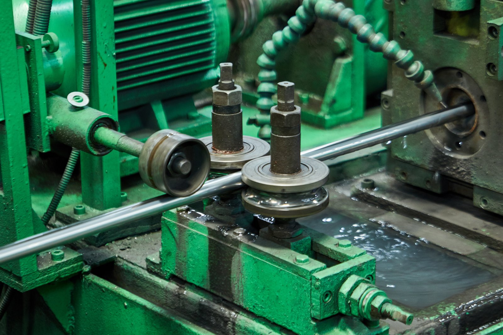 Dense matrix of stainless steel pipe forming stations inside MFY factory for industrial production